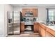 Kitchen featuring stainless steel appliances, wood cabinets, and light countertops at 513 S Cheatham St, Franklinton, NC 27525