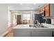 Kitchen featuring stainless steel appliances, wooden cabinets and a dining area at 513 S Cheatham St, Franklinton, NC 27525