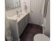 Bathroom with vanity, sink, new faucet, and a white toilet next to a white door at 529 Flanagan Rd, Henderson, NC 27537