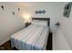 Charming bedroom featuring a cozy bed, stylish décor, and pictures on the walls at 529 Flanagan Rd, Henderson, NC 27537