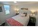 Cozy bedroom with wood flooring, window, and stylish decor at 529 Flanagan Rd, Henderson, NC 27537