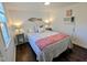 Cozy bedroom featuring a comfortable bed, stylish décor, and natural light from a window at 529 Flanagan Rd, Henderson, NC 27537