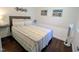 Comfortable bedroom featuring a cozy bed, stylish décor, and a modern wall-mounted fan at 529 Flanagan Rd, Henderson, NC 27537