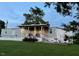 Charming single-story home with a covered front porch and well-manicured lawn at 529 Flanagan Rd, Henderson, NC 27537