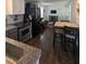 Open-concept design seamlessly connects kitchen and living area with hardwood flooring throughout at 529 Flanagan Rd, Henderson, NC 27537