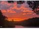 Scenic view of sunset, with trees lining the horizon and beautiful red clouds dominating the sky at 529 Flanagan Rd, Henderson, NC 27537