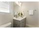 Stylish bathroom with a modern vanity, sleek fixtures, and a well-lit mirror at 604 Whistable Ave, Wake Forest, NC 27587