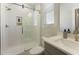 Modern bathroom with a glass-enclosed shower, white subway tile, and a sleek vanity at 604 Whistable Ave, Wake Forest, NC 27587