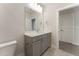 Bathroom featuring gray vanity, a light countertop, and a modern faucet at 604 Whistable Ave, Wake Forest, NC 27587