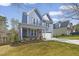 Charming two-story home with a two-car garage and a well-manicured front yard at 604 Whistable Ave, Wake Forest, NC 27587