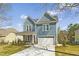 Charming two-story home with a two-car garage and a well-manicured front yard at 604 Whistable Ave, Wake Forest, NC 27587