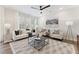 Cozy living room featuring neutral décor, recessed lighting, and a large window for plenty of natural light at 604 Whistable Ave, Wake Forest, NC 27587