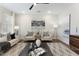 Bright living room with large area rug, modern furniture, natural light, and contemporary artwork at 604 Whistable Ave, Wake Forest, NC 27587