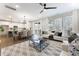 Open floor plan with kitchen, dining area, and living space with lots of natural light and hardwood flooring at 604 Whistable Ave, Wake Forest, NC 27587