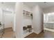 Organized mudroom with built-in storage, a bench, and easy access to the rest of the home at 604 Whistable Ave, Wake Forest, NC 27587