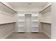 Spacious walk-in closet with built-in shelving and rods for storage, providing ample space at 604 Whistable Ave, Wake Forest, NC 27587