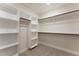 Spacious walk-in closet with built-in shelving and rods for storage, providing ample space at 604 Whistable Ave, Wake Forest, NC 27587