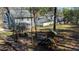 Large backyard with playground, trampoline, seating and plenty of shade at 627 Nixon Dr, Sanford, NC 27330