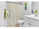 Clean bathroom with ducky shower curtain, single sink and plush towels at 627 Nixon Dr, Sanford, NC 27330