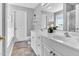 Bathroom with a double sink vanity, large mirror, and separate toilet and shower area at 627 Nixon Dr, Sanford, NC 27330