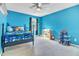 Vibrantly painted bedroom with ceiling fan and carpeted floor at 627 Nixon Dr, Sanford, NC 27330