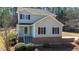 Inviting home featuring classic black shutters, a cozy porch, and brick accents at 627 Nixon Dr, Sanford, NC 27330