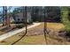 Two story home with a long driveway, lawn and wooded background at 627 Nixon Dr, Sanford, NC 27330