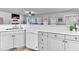 Bright kitchen with white cabinets, dishwasher and plenty of counter space for cooking prep at 627 Nixon Dr, Sanford, NC 27330