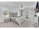 Spacious primary bedroom with a ceiling fan and a TV at 627 Nixon Dr, Sanford, NC 27330