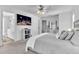 Beautiful primary bedroom featuring a flat screen TV and direct access to the en-suite bathroom at 627 Nixon Dr, Sanford, NC 27330