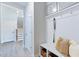 Bright entryway with wainscoting, coat hooks, and storage at 664 Sun Meadow Dr, Wake Forest, NC 27587