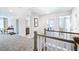 Bright hallway that provides access to a bathroom, a laundry room, a bedroom and a loft work area at 664 Sun Meadow Dr, Wake Forest, NC 27587