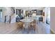 Bright, open-concept kitchen with modern lighting and stainless steel appliances at 664 Sun Meadow Dr, Wake Forest, NC 27587