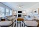 Cozy living room with ceiling fan, fireplace, ample seating, and neutral decor at 664 Sun Meadow Dr, Wake Forest, NC 27587