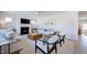 Well-lit living room with a fireplace, ceiling fan, comfortable seating, and decor at 664 Sun Meadow Dr, Wake Forest, NC 27587