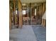 An interior renovation in progress; exposed wall studs and flooring at 707 Dickens St, Roxboro, NC 27573