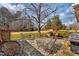 Spacious backyard patio with stone pavers, seating, and a grill, perfect for outdoor entertaining at 712 Springwood Ave, Gibsonville, NC 27249