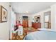 Bedroom with hardwood floors, dresser, and TV at 712 Springwood Ave, Gibsonville, NC 27249