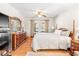Comfortable bedroom with hardwood floors, ceiling fan and lots of natural light at 712 Springwood Ave, Gibsonville, NC 27249