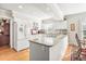 Open-concept kitchen boasts white cabinetry, granite countertops and stainless appliances at 712 Springwood Ave, Gibsonville, NC 27249