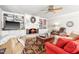 Inviting living room with fireplace, bookshelves and comfortable seating arrangement at 712 Springwood Ave, Gibsonville, NC 27249