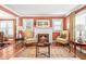 Bright living room featuring a fireplace, hardwood floors, and comfortable seating at 712 Springwood Ave, Gibsonville, NC 27249