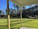 View from the covered patio looking out to the lush green backyard at 72 Heatherglenn Cir, Princeton, NC 27569