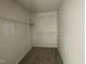 Walk-in closet with wire shelving, providing ample storage space and organizational options for clothing and accessories at 72 Heatherglenn Cir, Princeton, NC 27569