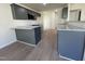 Stylish kitchen featuring granite countertops, gray cabinetry, a breakfast bar, and stainless steel appliances at 72 Heatherglenn Cir, Princeton, NC 27569
