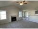 Spacious living room with vaulted ceilings, fireplace, and neutral carpeting, perfect for relaxation and gatherings at 72 Heatherglenn Cir, Princeton, NC 27569