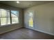 Bright room with hardwood floors and a glass door leading outside, providing natural light and easy access at 72 Heatherglenn Cir, Princeton, NC 27569