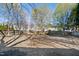 Large fenced backyard provides privacy, shade trees, and space for recreation and entertaining at 7604 Derek Dr, Raleigh, NC 27613