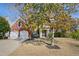 Charming red brick home with a well-manicured lawn, two car garage, and inviting front entrance at 7604 Derek Dr, Raleigh, NC 27613