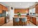Spacious kitchen featuring stainless steel appliances, an island with seating, and tiled backsplash at 7604 Derek Dr, Raleigh, NC 27613